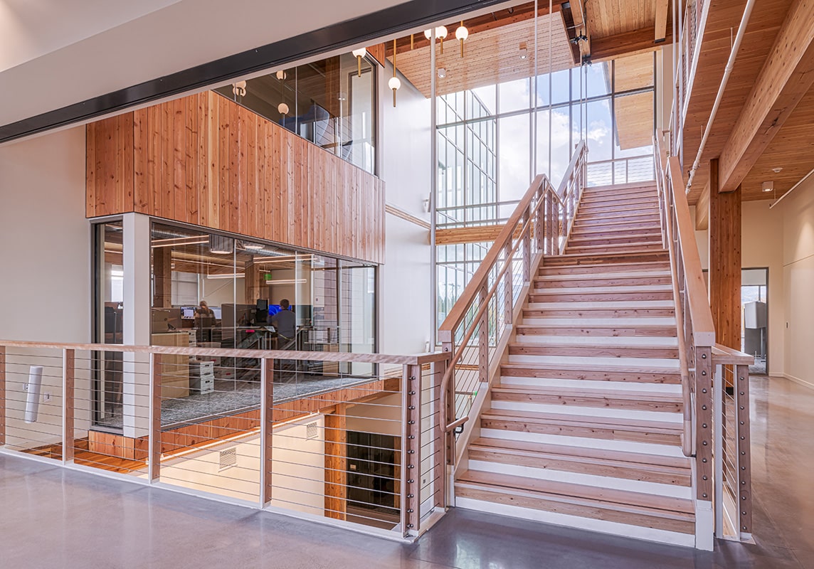The large staircase welcomes employees and customers alike. 