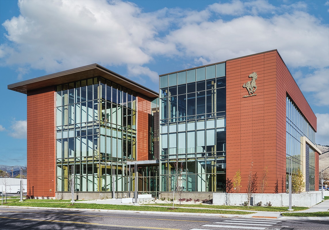 The building’s mass timber elements can be seen through the building’s glass front. 