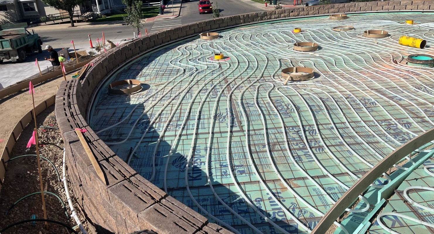 Installation of the heated sidewalk system in the sitting area.