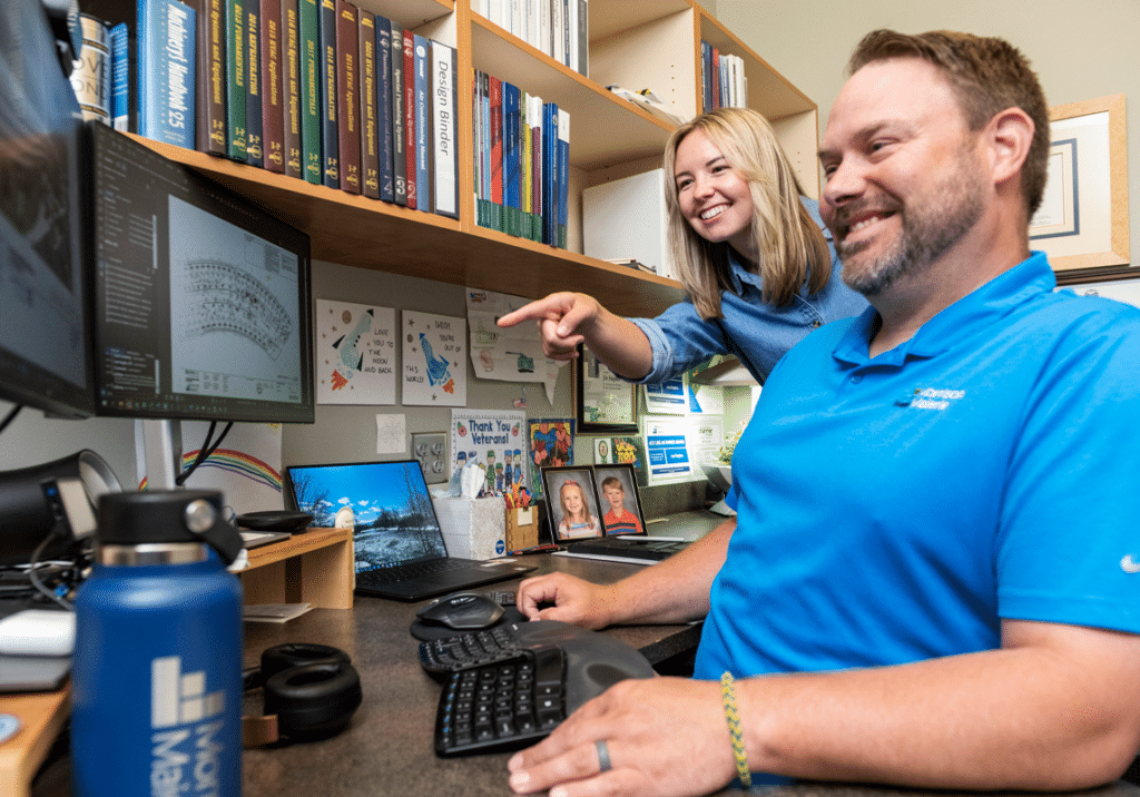 engineers Carly Svenvold and Joe Hughes collaborate on a project, Morrison-Maierle